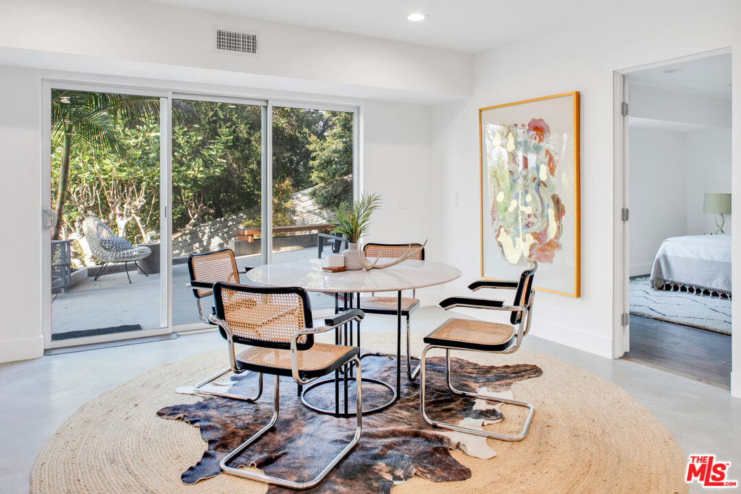 2945 Angus Street Los Angeles, CA 90039 - Photo 38 of 52 a dining room with furniture and wooden floor