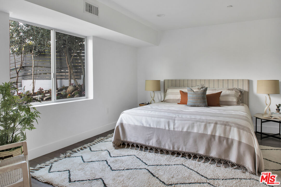 2945 Angus Street Los Angeles, CA 90039 - Photo 39 of 52 a bedroom with a bed and a potted plant