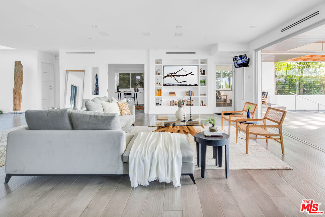 2945 Angus Street Los Angeles, CA 90039 - Photo 10 of 52 a living room with furniture and a wooden floor