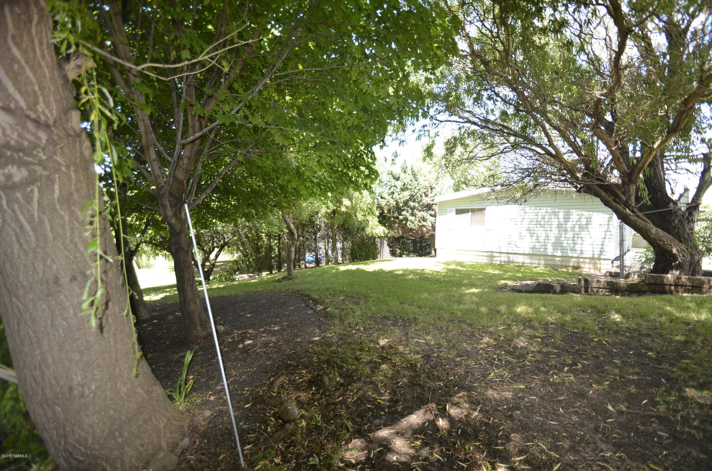 13206 Summitview Ext Road Yakima, WA 98908 - Photo 20 of 29 a view of a yard with plants and trees
