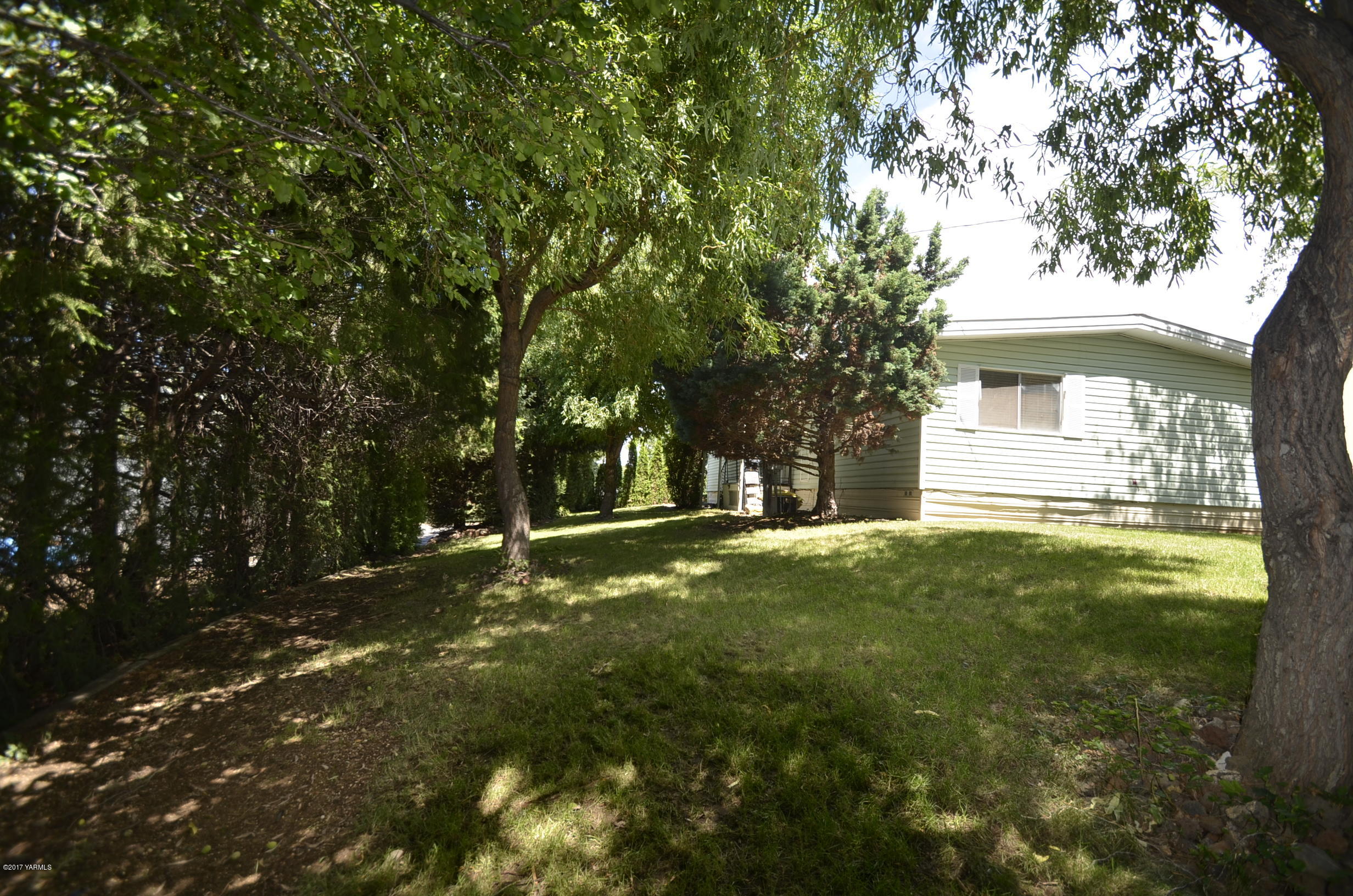 13206 Summitview Ext Road Yakima, WA 98908 - Photo 21 of 29 a view of a house with yard and tree s