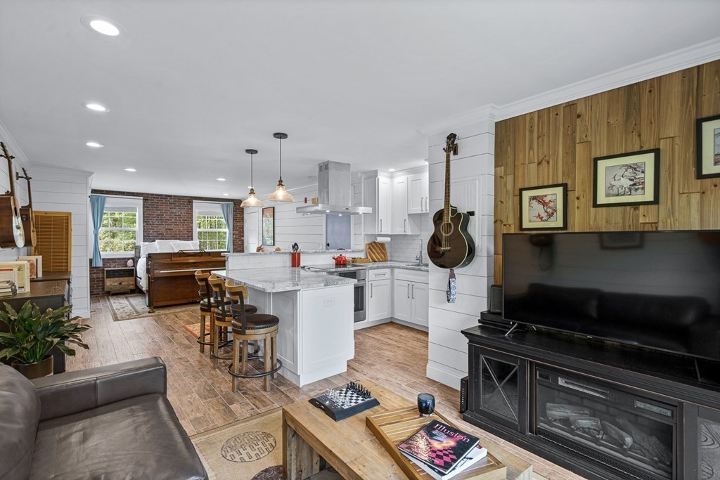 39 Liberty Square Road, Unit D Boxborough, MA 01719 - Photo 12 of 26 a living room with furniture and wooden floor