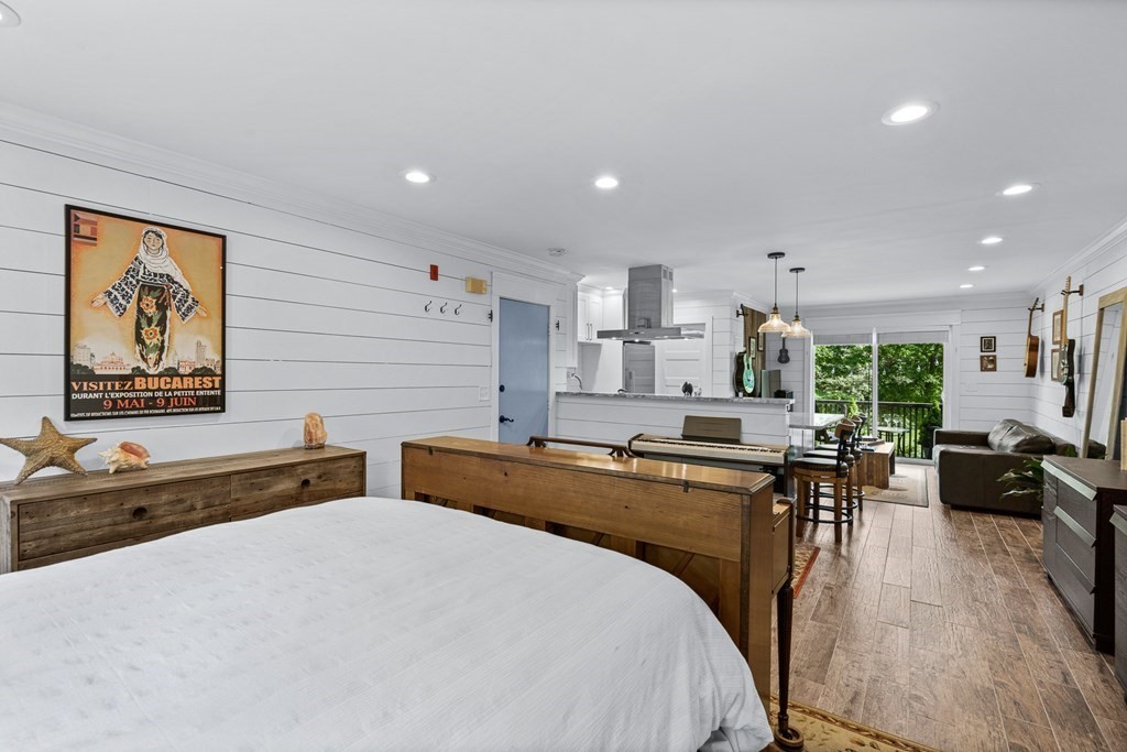 39 Liberty Square Road, Unit D Boxborough, MA 01719 - Photo 17 of 26 a large kitchen with kitchen island a stove a sink a dining table and chairs