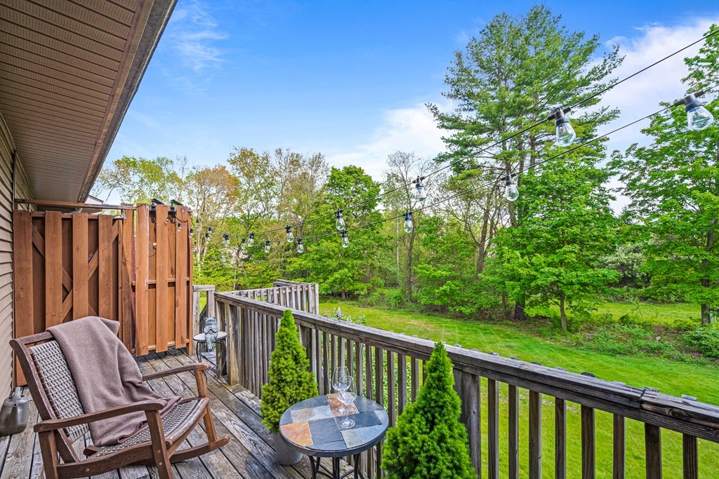 39 Liberty Square Road, Unit D Boxborough, MA 01719 - Photo 19 of 26 a view of a chair and table in the balcony