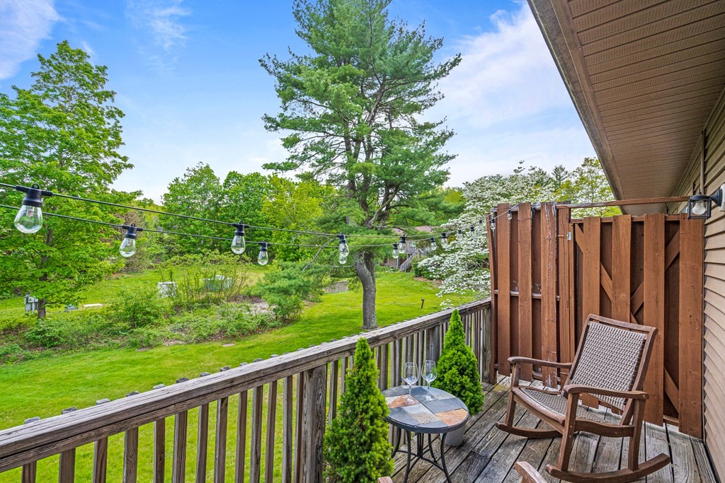 39 Liberty Square Road, Unit D Boxborough, MA 01719 - Photo 20 of 26 a view of a chair and table in backyard of the house
