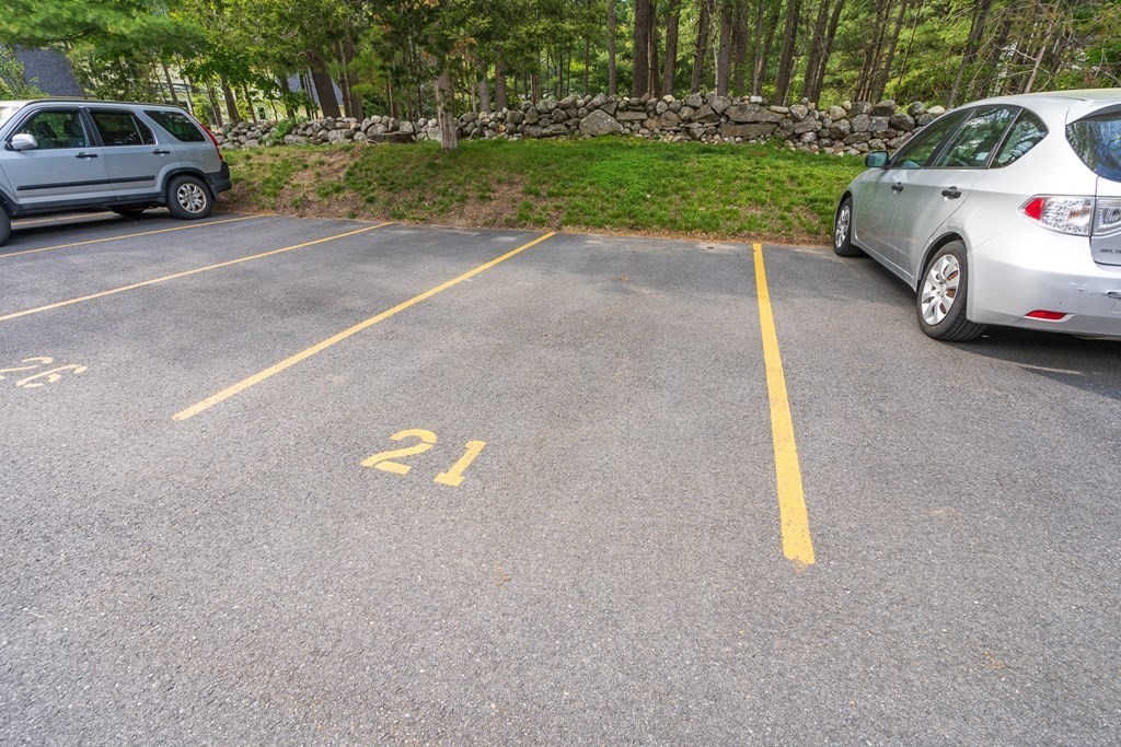 39 Liberty Square Road, Unit D Boxborough, MA 01719 - Photo 22 of 26 a car parked on the side of the road