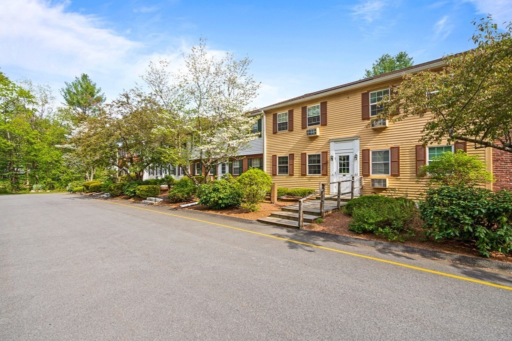 39 Liberty Square Road, Unit D Boxborough, MA 01719 - Photo 24 of 26 front view of a house with a yard
