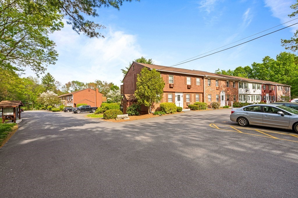 39 Liberty Square Road, Unit D Boxborough, MA 01719 - Photo 25 of 26 a car parked on the side of a street