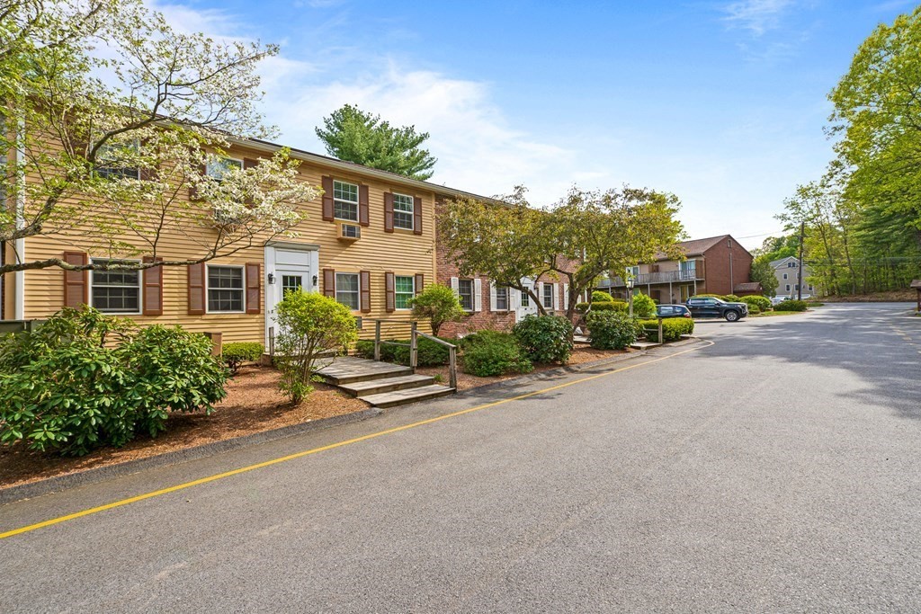 39 Liberty Square Road, Unit D Boxborough, MA 01719 - Photo 26 of 26 front view of a house with a street