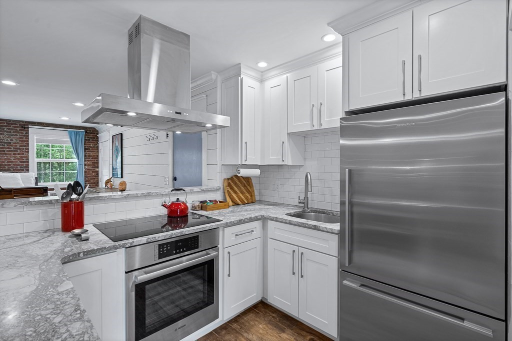 39 Liberty Square Road, Unit D Boxborough, MA 01719 - Photo 3 of 26 a kitchen with stainless steel appliances cabinets and a window