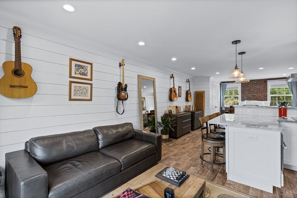 39 Liberty Square Road, Unit D Boxborough, MA 01719 - Photo 9 of 26 a living room with furniture and kitchen view