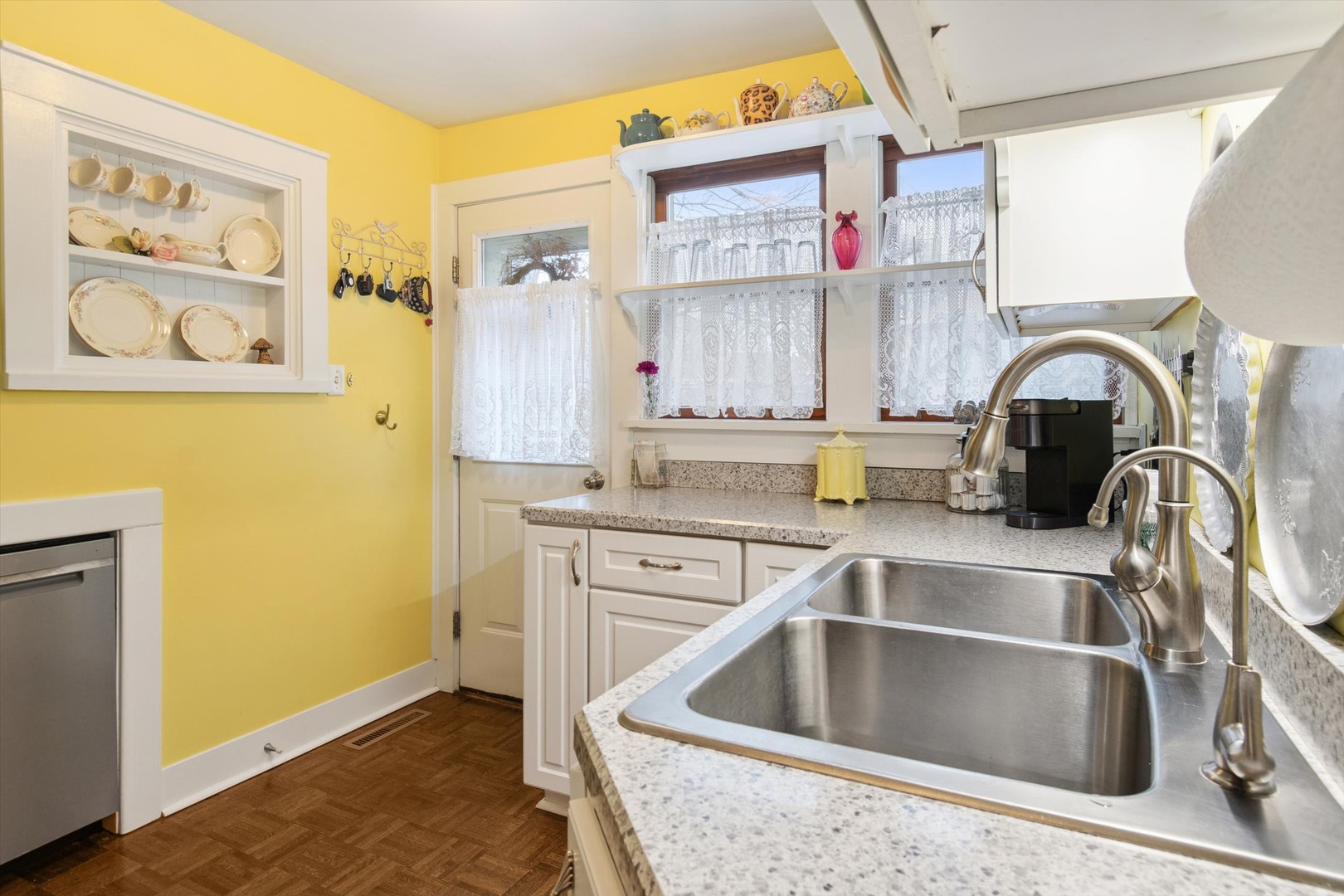 628 East Main Street Morris, IL 60450 - Photo 17 of 32 a kitchen with a sink cabinets and a wooden floor