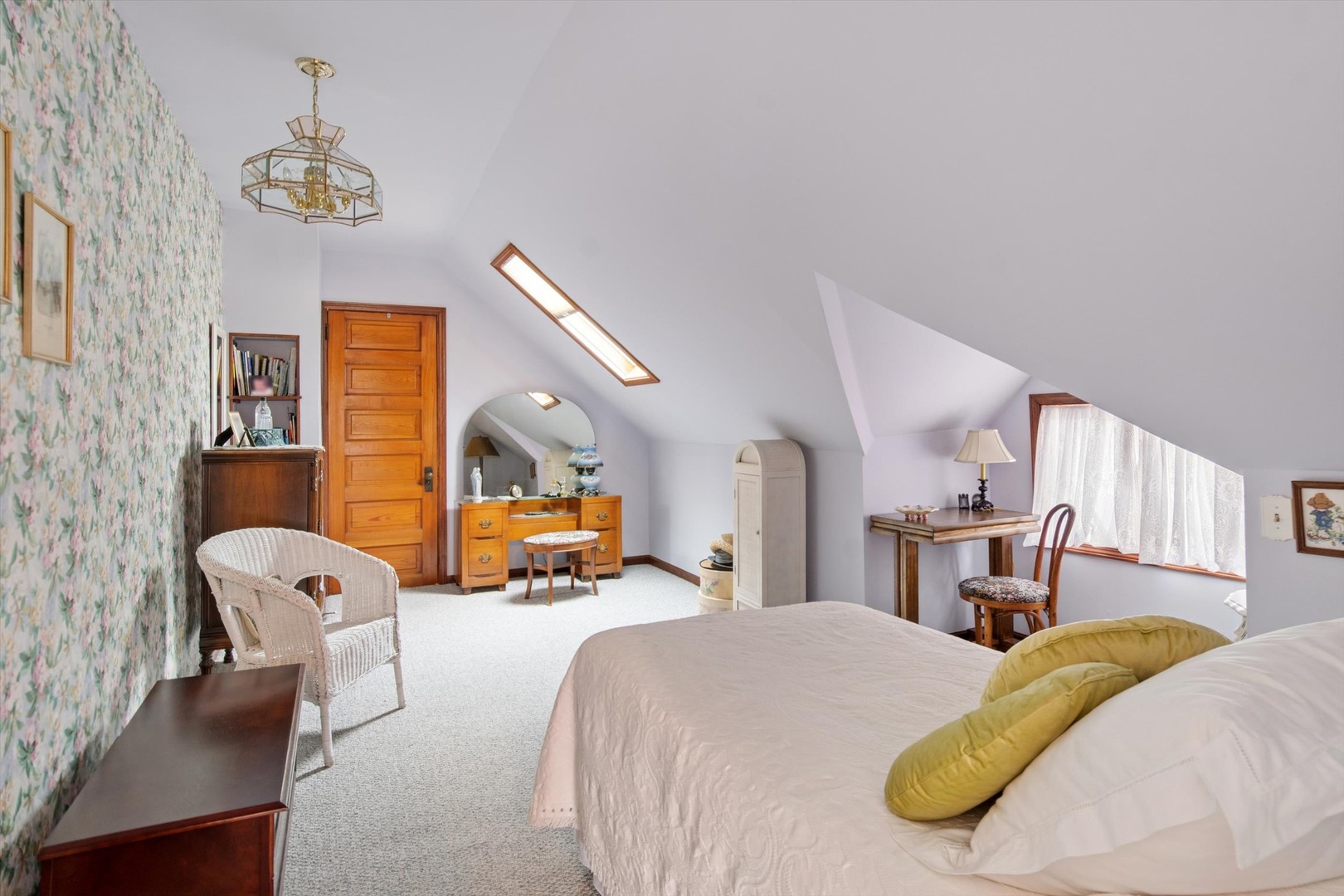 628 East Main Street Morris, IL 60450 - Photo 21 of 32 a bed room with a bed and a chandelier