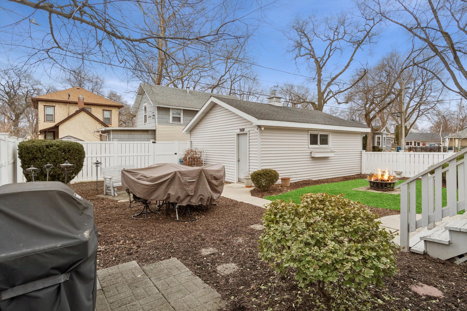 628 East Main Street Morris, IL 60450 - Photo 24 of 32 a view of a backyard with table and chairs and wooden fence