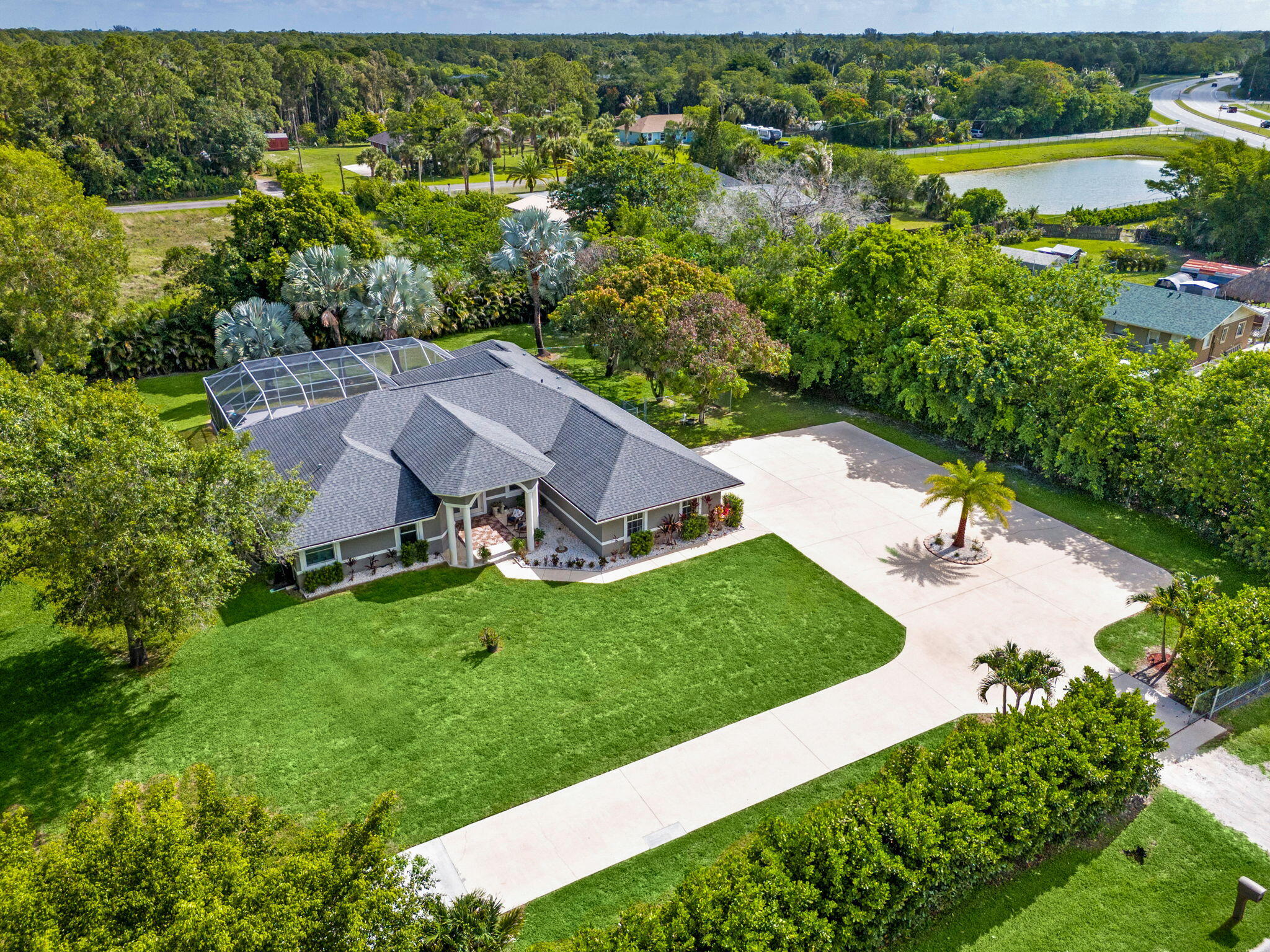 16685 63rd Road North Loxahatchee, FL 33470 - Photo 3 of 73 51-web-or-mls-DJI_20260525101353_0995_D