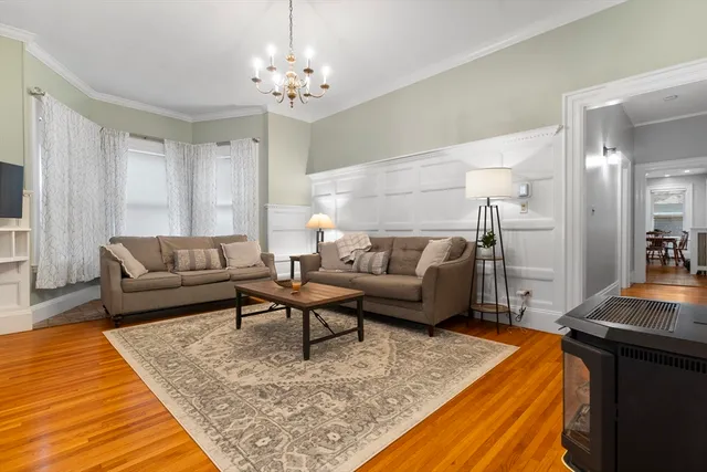 a living room with furniture and a rug
