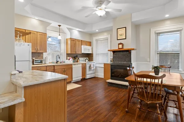 a living room with stainless steel appliances kitchen island granite countertop furniture and a kitchen view