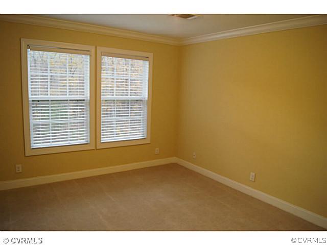 13700 Cedar Creek Road Chesterfield, VA 23838 - Photo 12 of 21 a view of an empty room with a window and a ceiling window