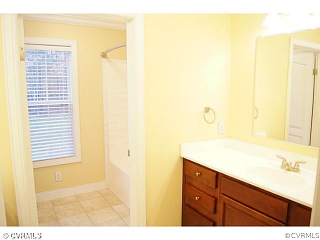 13700 Cedar Creek Road Chesterfield, VA 23838 - Photo 15 of 21 a bathroom with a sink and a mirror