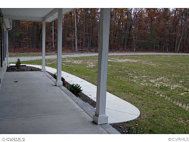 13700 Cedar Creek Road Chesterfield, VA 23838 - Photo 17 of 21 a view of a house with backyard and porch