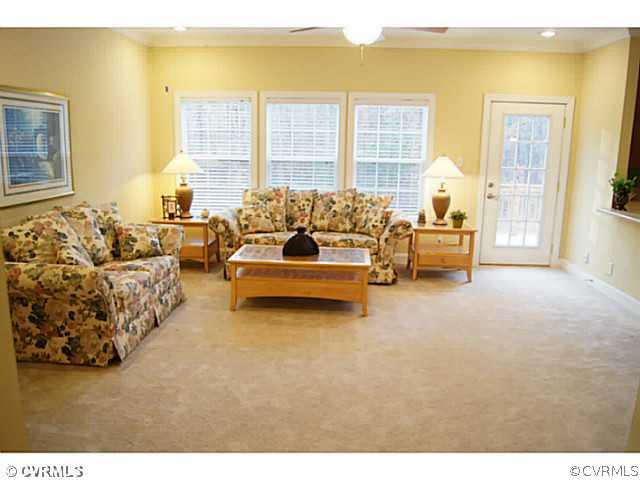 13700 Cedar Creek Road Chesterfield, VA 23838 - Photo 6 of 21 a living room with furniture and a floor to ceiling window