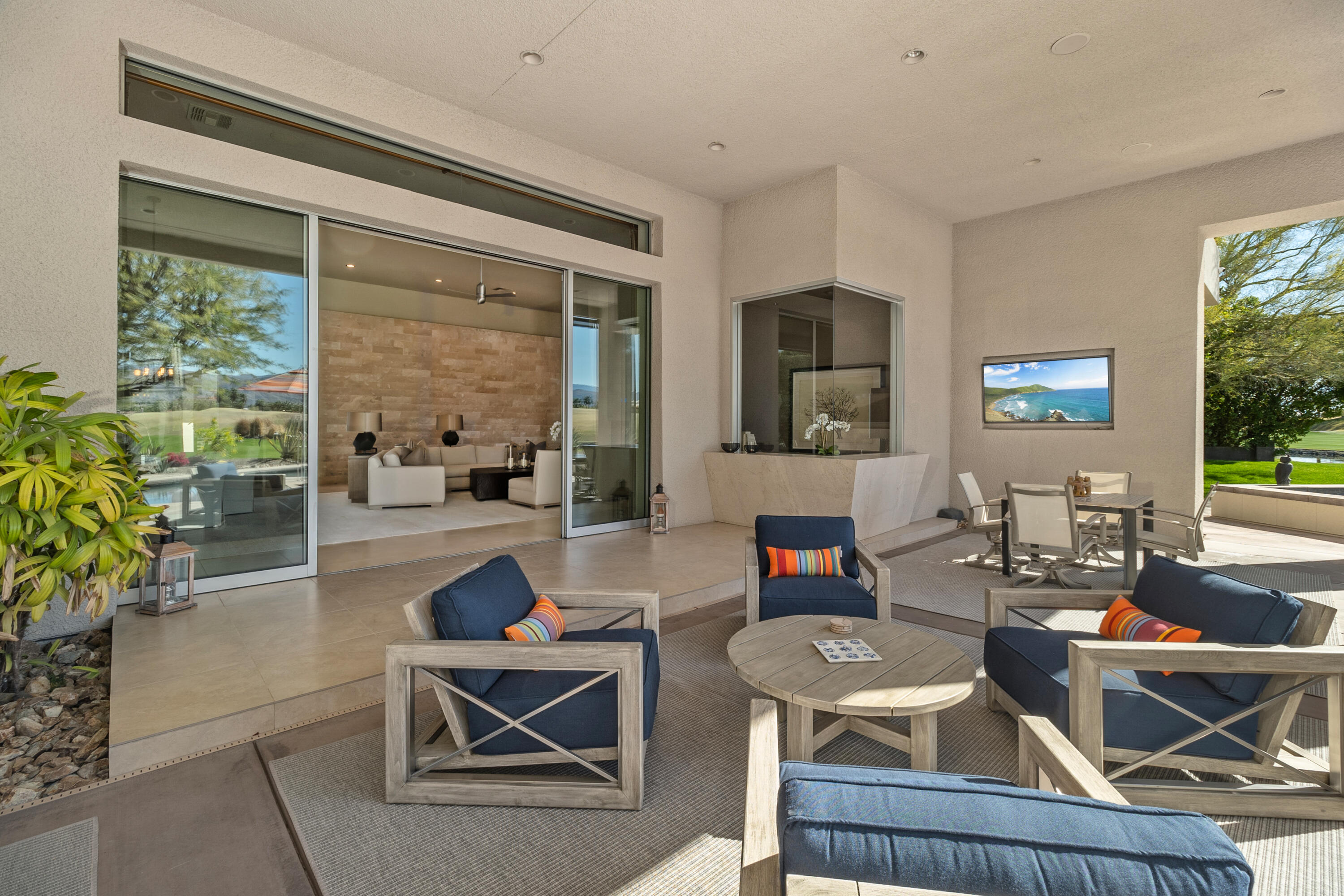 81 Royal St Georges Way Rancho Mirage, CA 92270 - Photo 13 of 59 a living room with fireplace furniture and a large window
