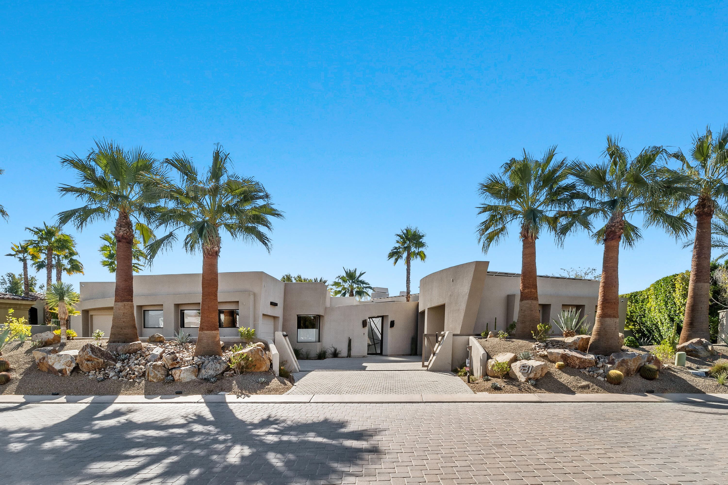 81 Royal St Georges Way Rancho Mirage, CA 92270 - Photo 15 of 59 a view of a palm tree with flower garden