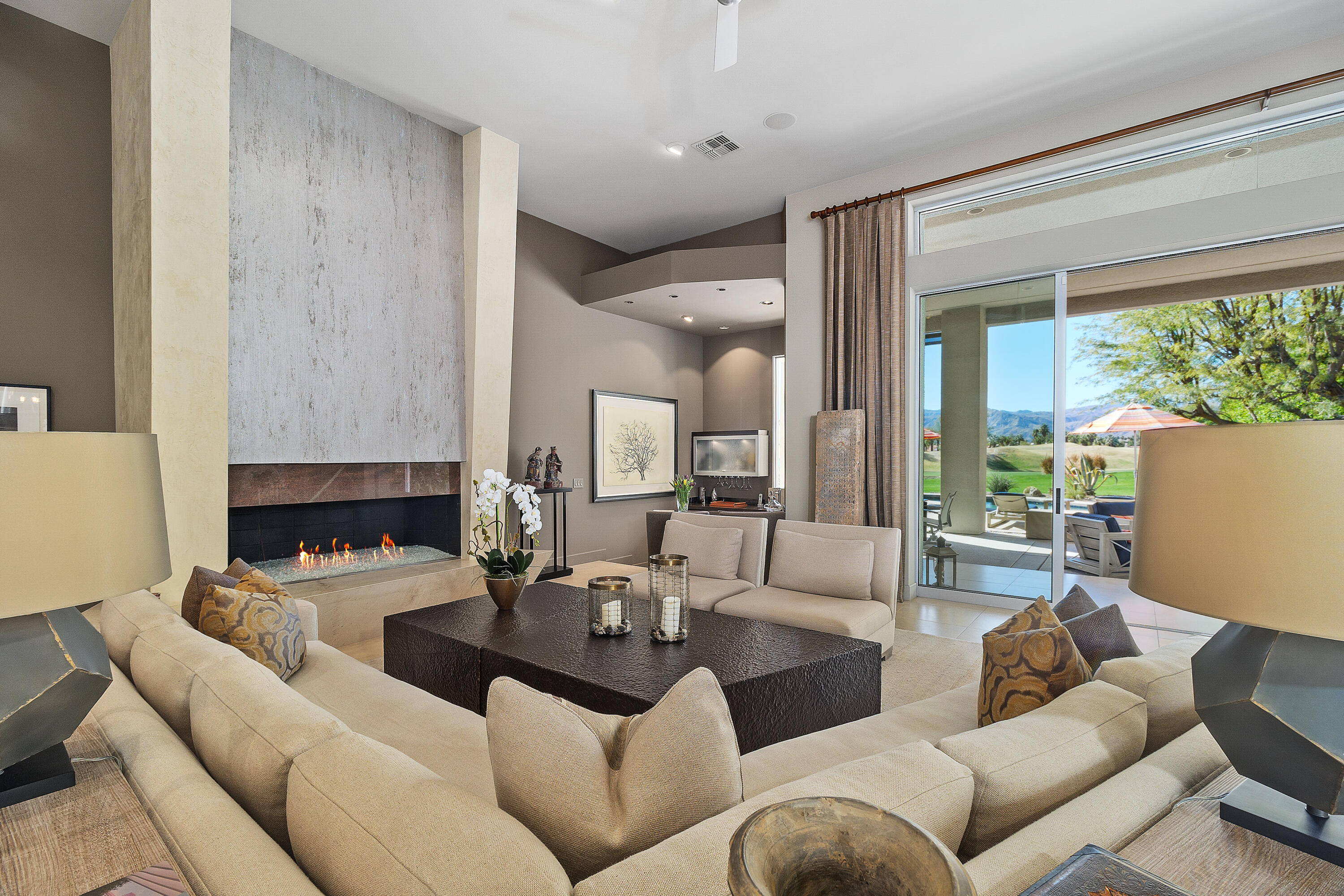 81 Royal St Georges Way Rancho Mirage, CA 92270 - Photo 20 of 59 a living room with furniture and a fireplace