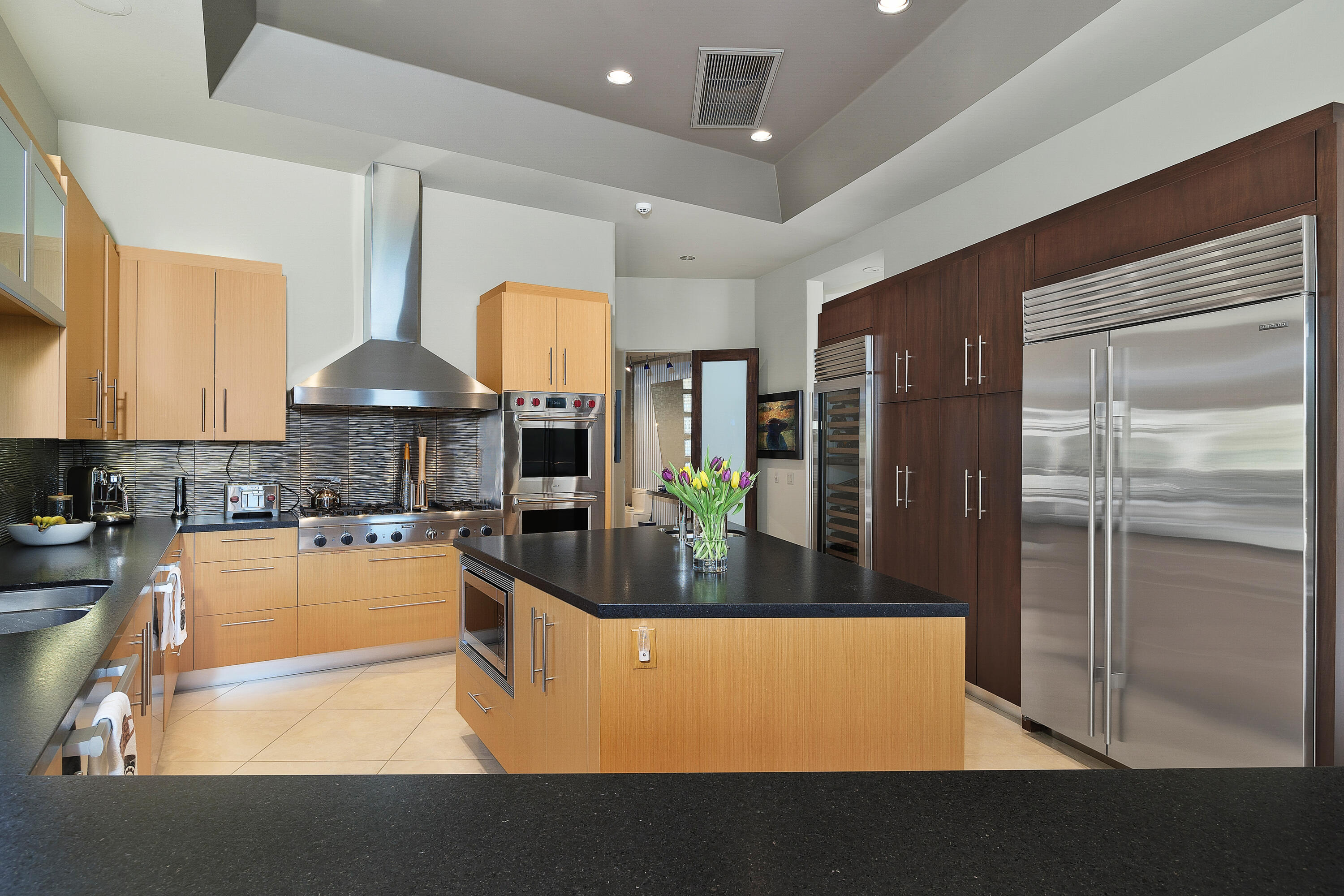 81 Royal St Georges Way Rancho Mirage, CA 92270 - Photo 28 of 59 a kitchen with counter top space and stainless steel appliances
