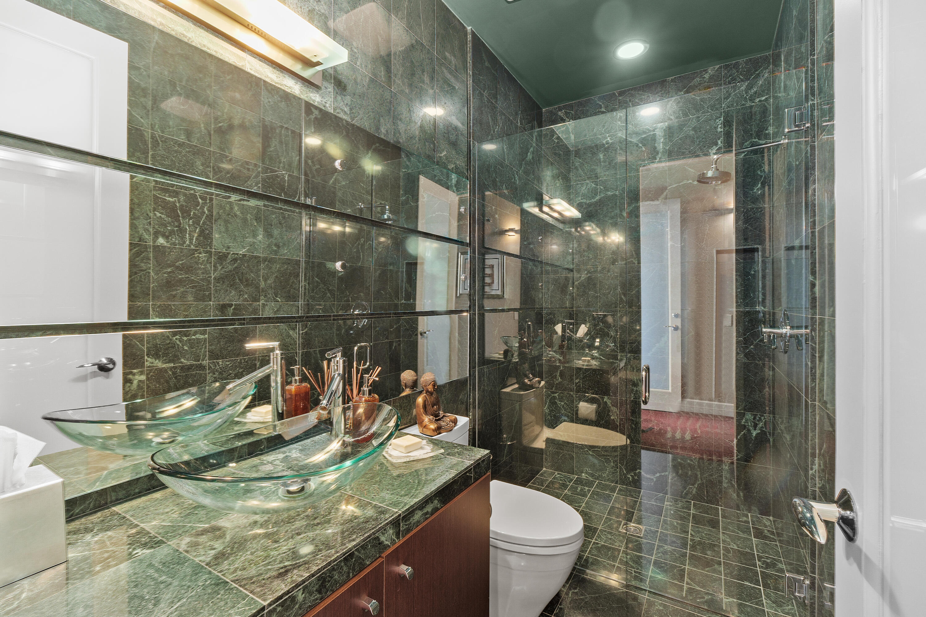 81 Royal St Georges Way Rancho Mirage, CA 92270 - Photo 33 of 59 a bathroom with a granite countertop sink a toilet and shower