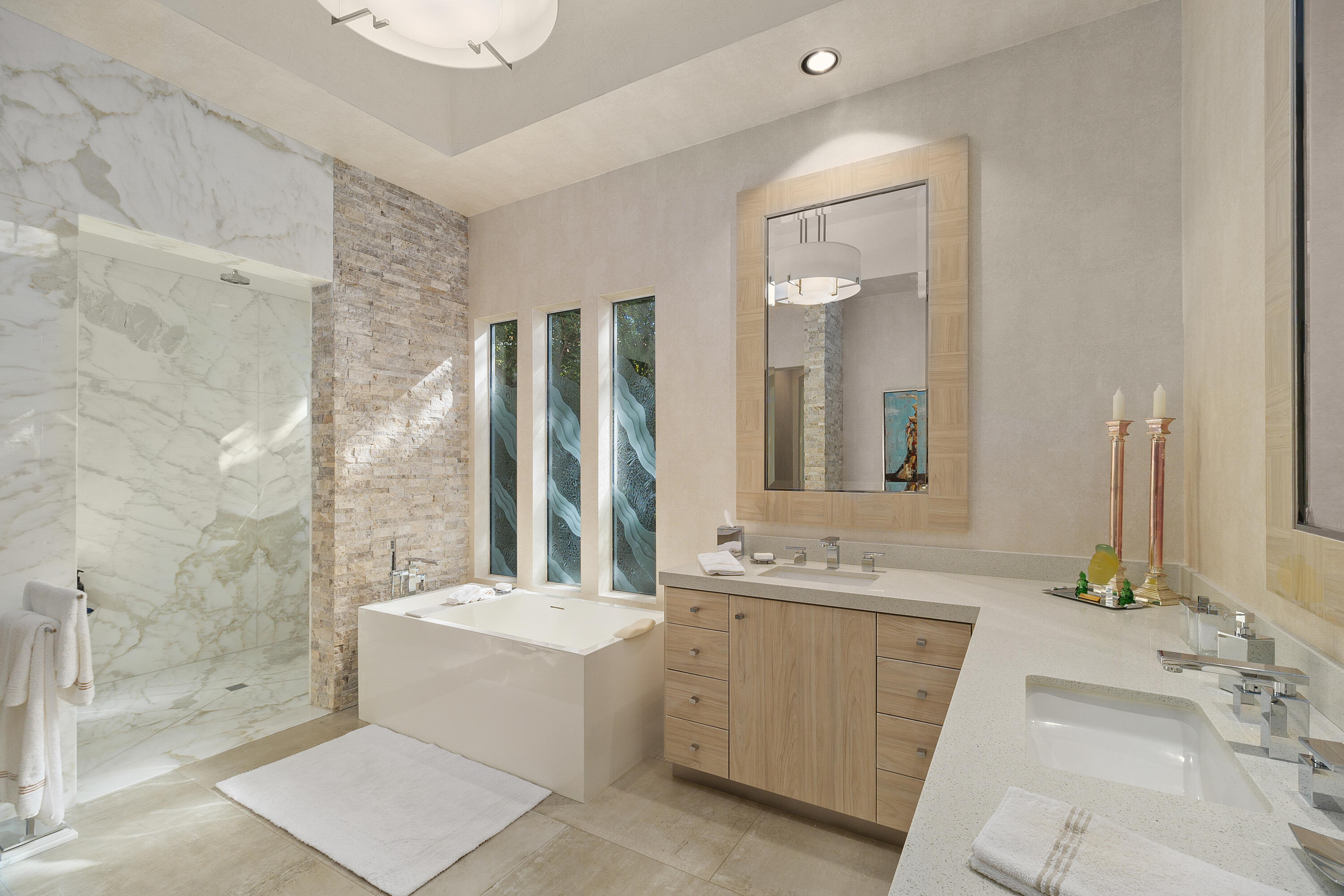 81 Royal St Georges Way Rancho Mirage, CA 92270 - Photo 38 of 59 a bathroom with a double vanity sink a mirror and a bathtub