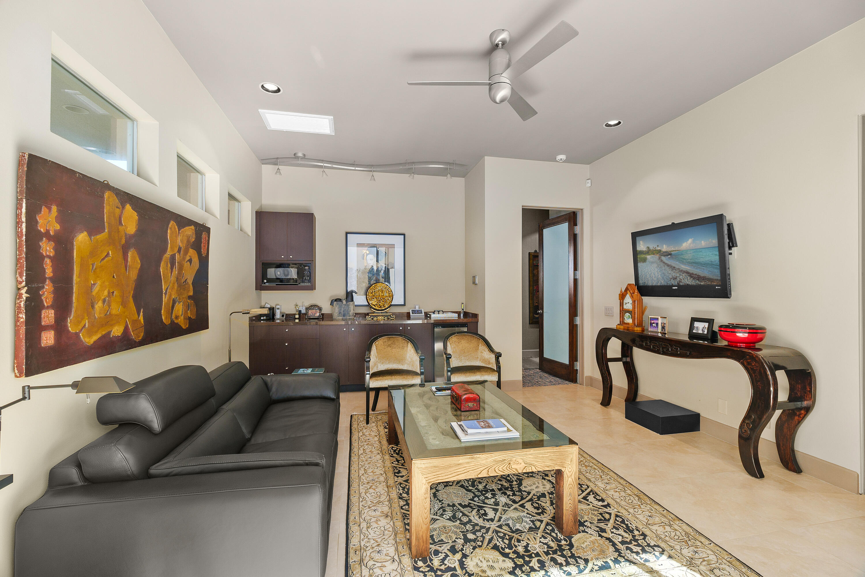 81 Royal St Georges Way Rancho Mirage, CA 92270 - Photo 42 of 59 a living room with furniture a flat screen tv and a couch