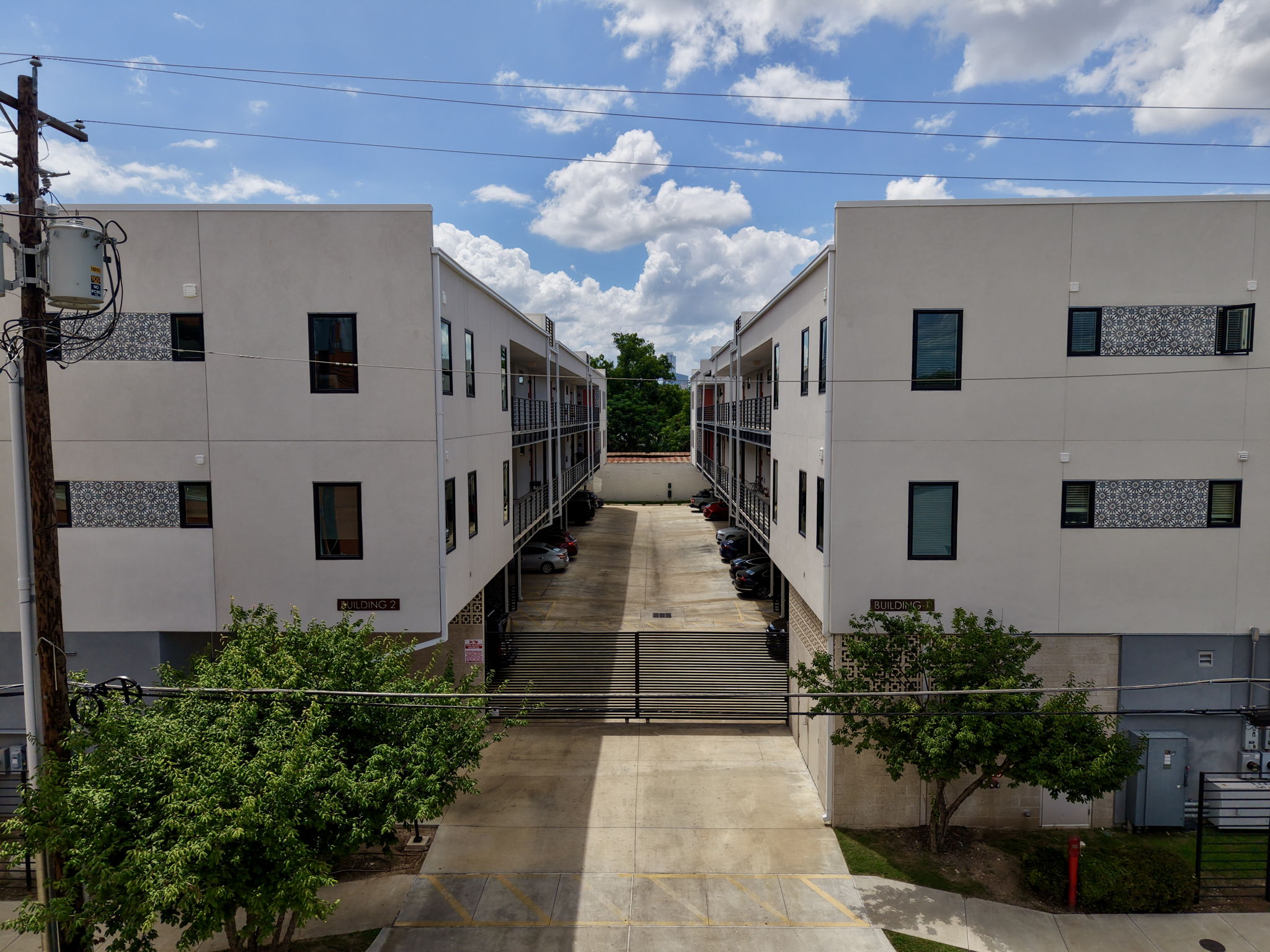 2709 East 5th Street, Unit 1306 Austin, TX 78702 - Photo 27 of 28 Contemporary apartment complex with clean lines and patterned exterior accents.