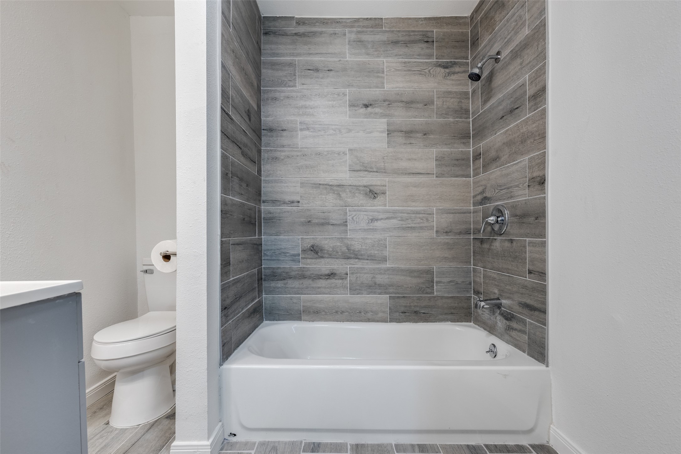 200 Pine Street Prairie View, TX 77446 - Photo 12 of 25 a bathroom with a shower and a toilet