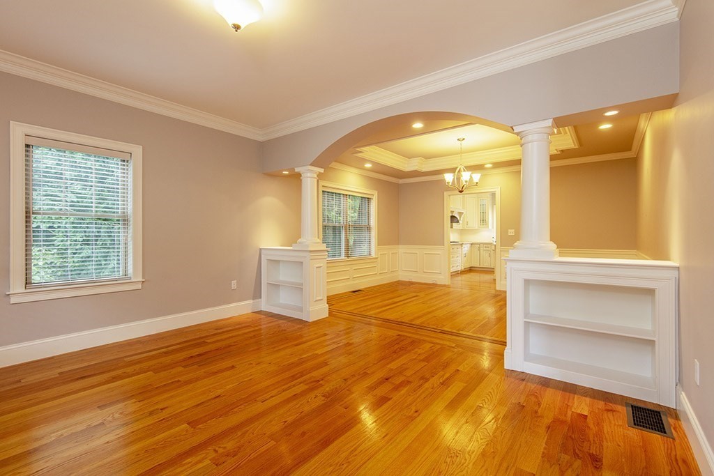 33 Liberty Avenue Lexington, MA 02420 - Photo 8 of 30 a view of an empty room with wooden floor and a window