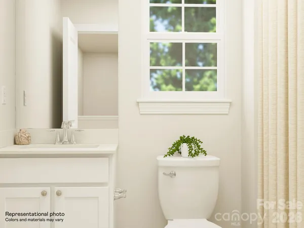 a bedroom with a bed and a view of bathroom