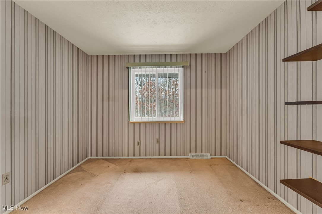 6470 State Road, Unit K5 Parma, OH 44134 - Photo 22 of 26 Unfurnished room featuring a textured ceiling