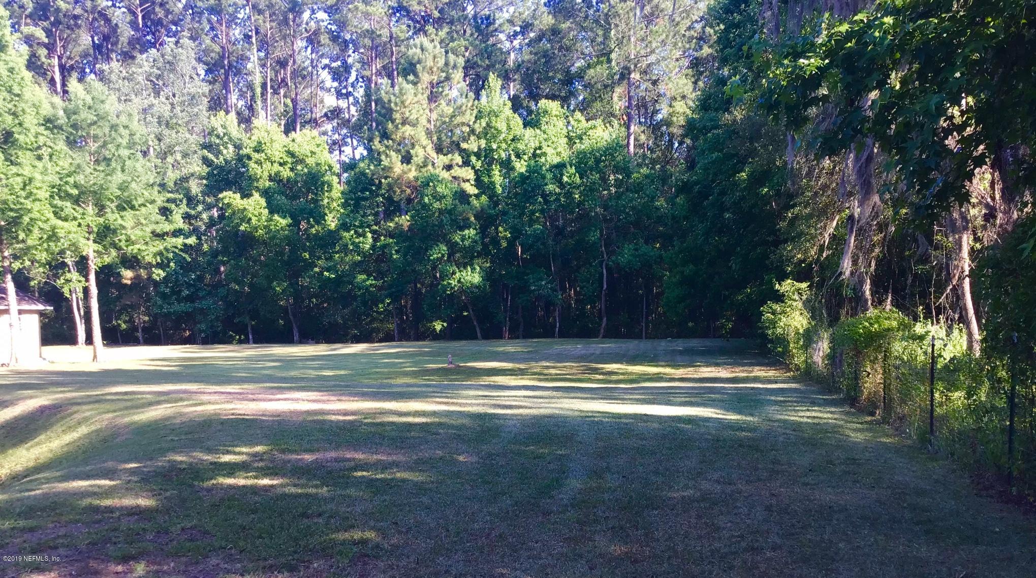 45108 R Jones Road Callahan, FL 32011 - Photo 4 of 20 a view of a yard with large trees