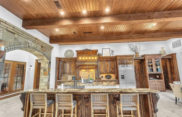 a living room with furniture pool table and a large window