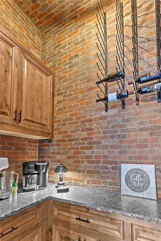 a bedroom with furniture and a large window