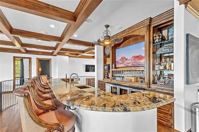 a living room with furniture a couch and chandelier