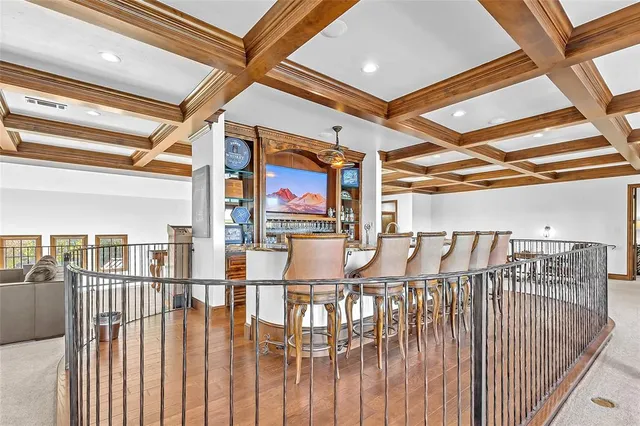 a bedroom with furniture and large windows