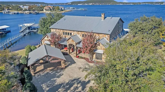 an aerial view of a house with a yard