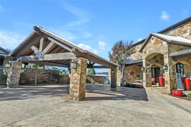 a view of a lake with table and chairs