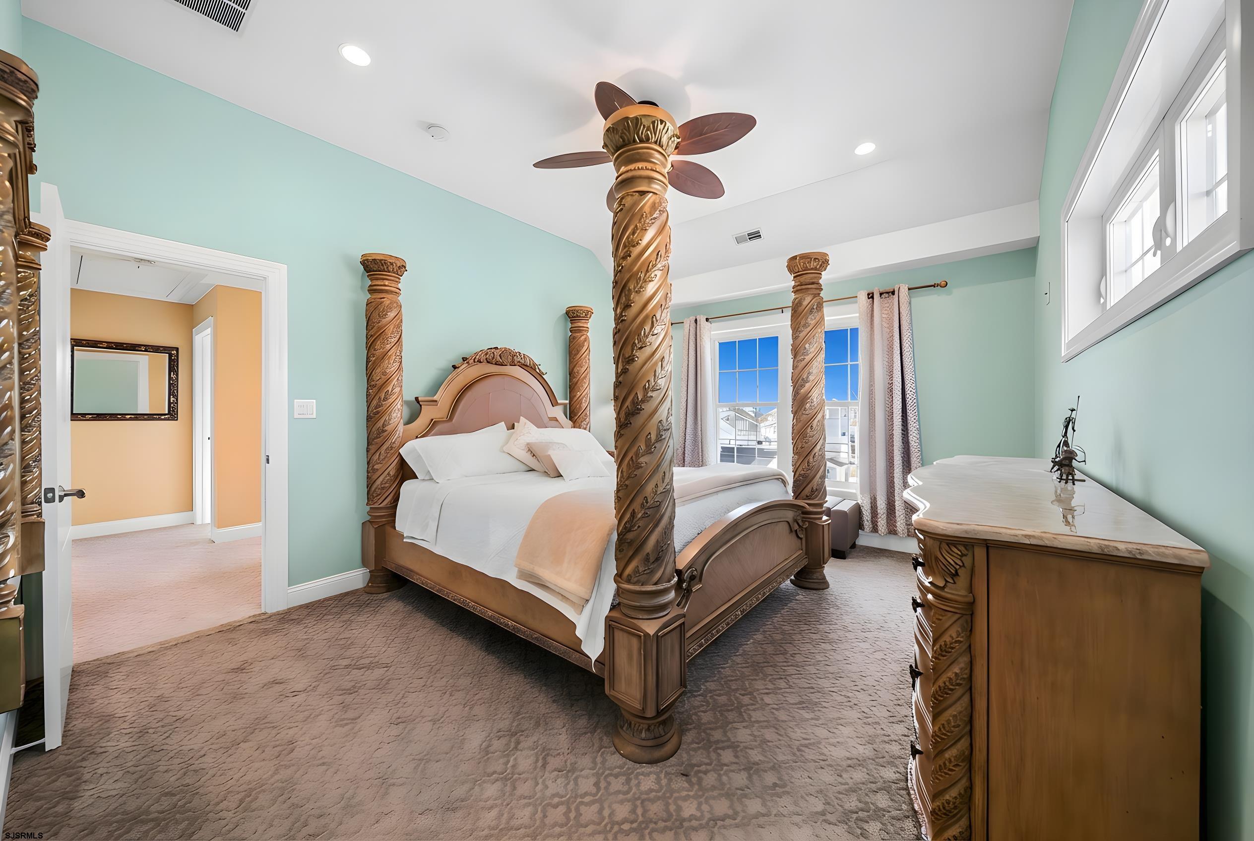 9 Cummings Place Brigantine, NJ 08203 - Photo 23 of 39 a bedroom with a bed and a chandelier