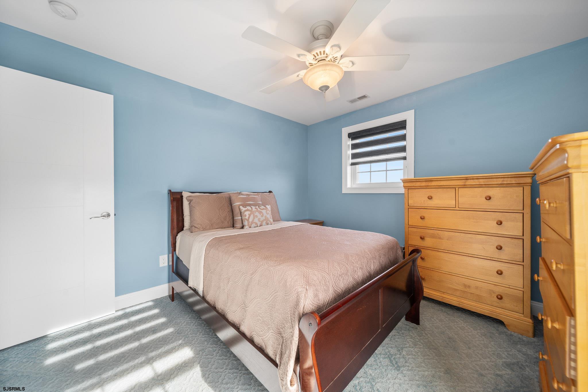 9 Cummings Place Brigantine, NJ 08203 - Photo 28 of 39 a bedroom with a bed and a dresser