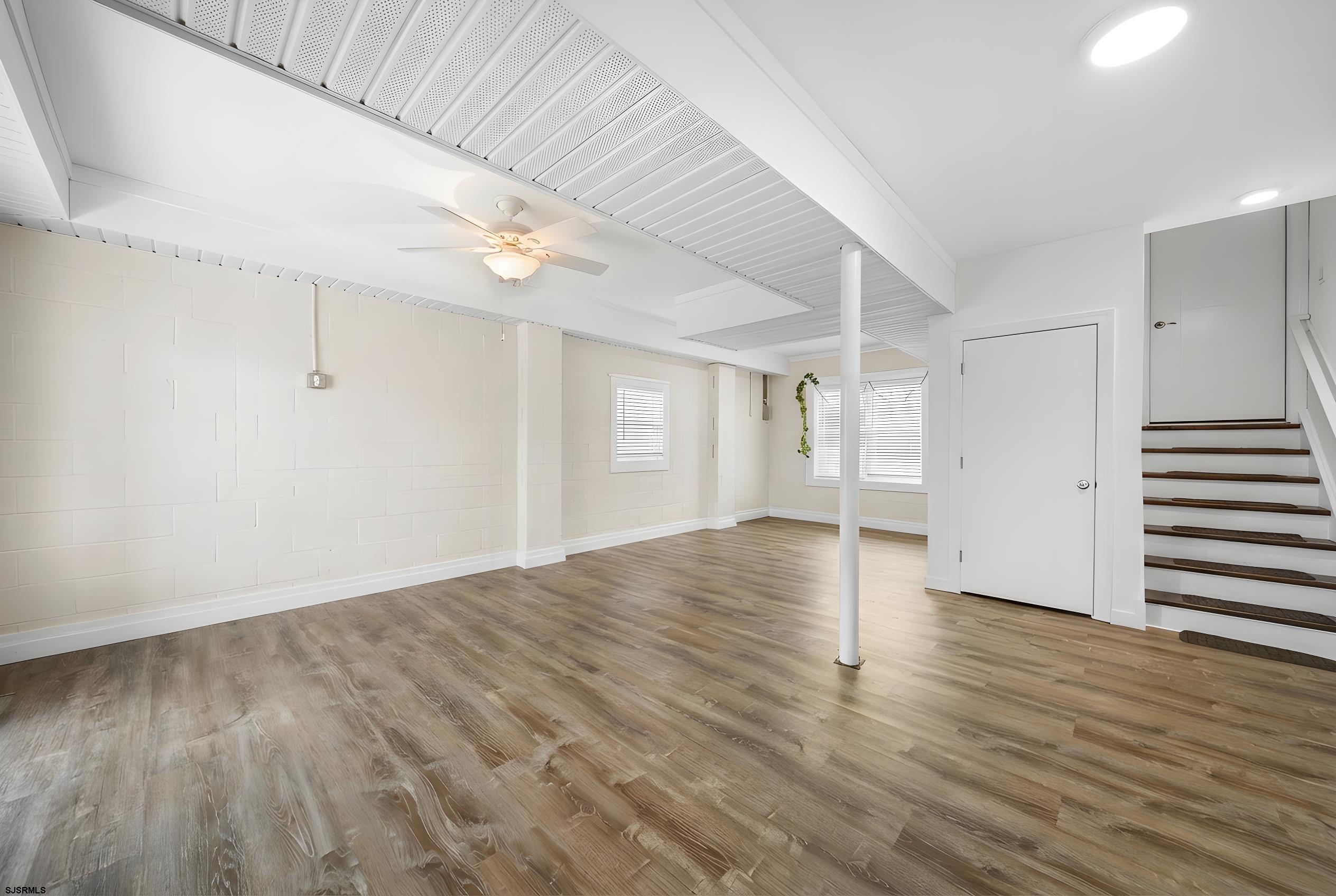 9 Cummings Place Brigantine, NJ 08203 - Photo 30 of 39 a view of empty room with wooden floor and fan