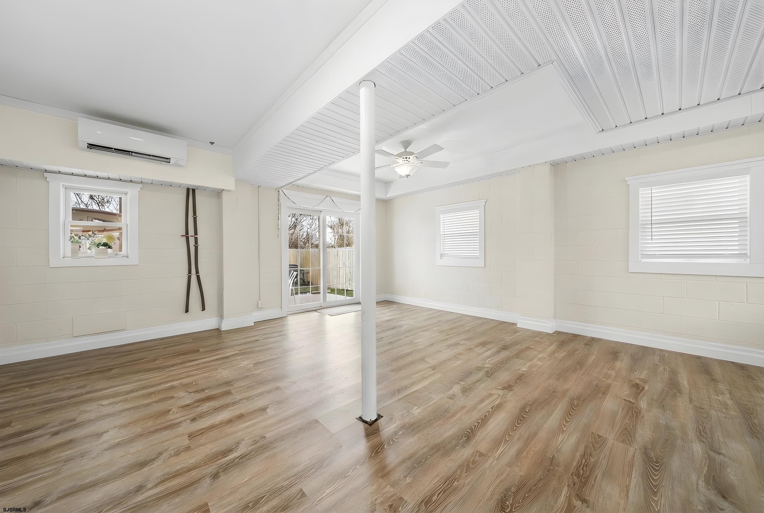 9 Cummings Place Brigantine, NJ 08203 - Photo 31 of 39 an empty room with wooden floor and windows
