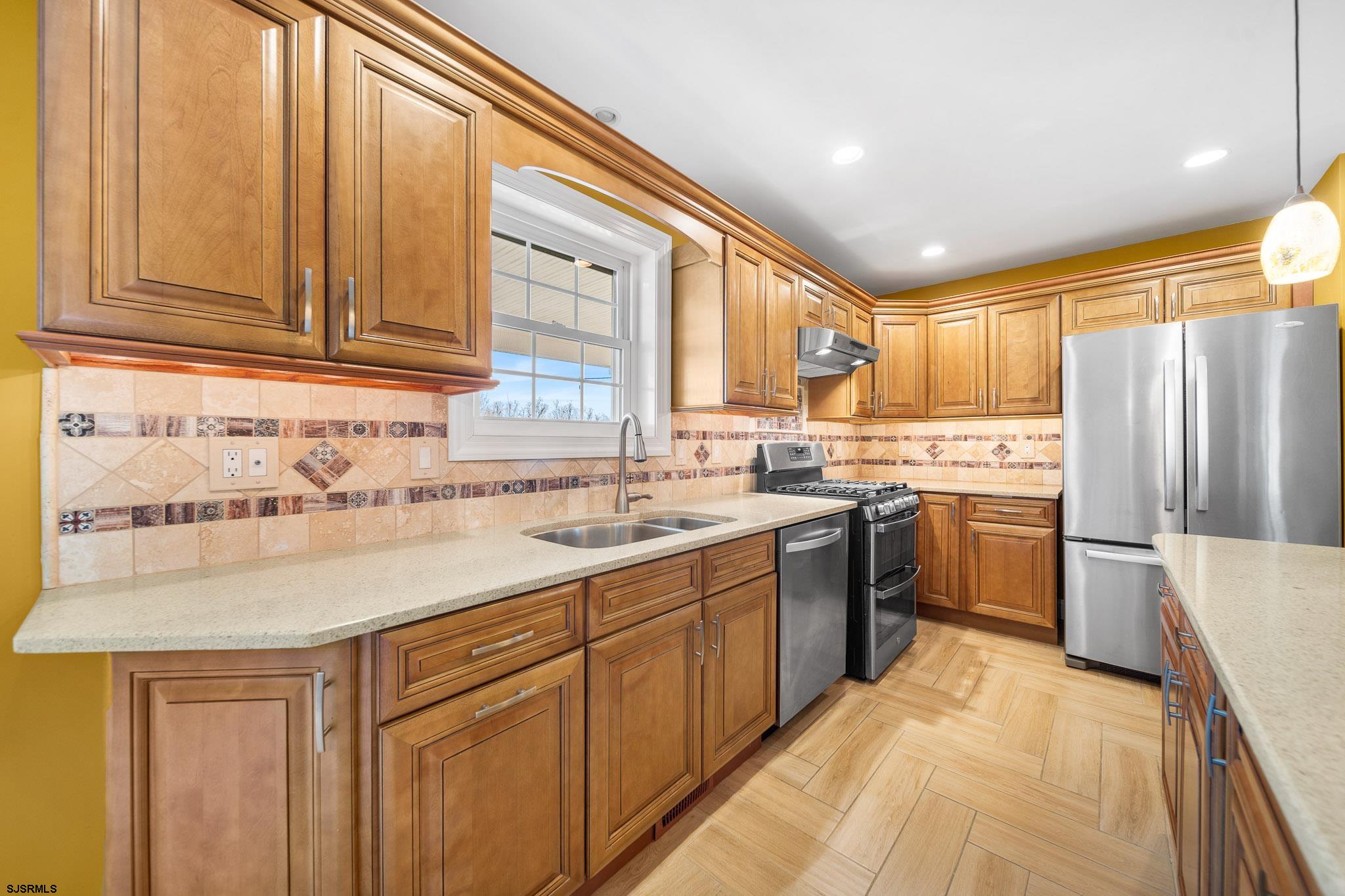 9 Cummings Place Brigantine, NJ 08203 - Photo 10 of 39 a kitchen with a sink window and stainless steel appliances