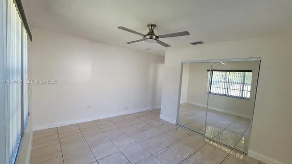 a view of an empty room and window